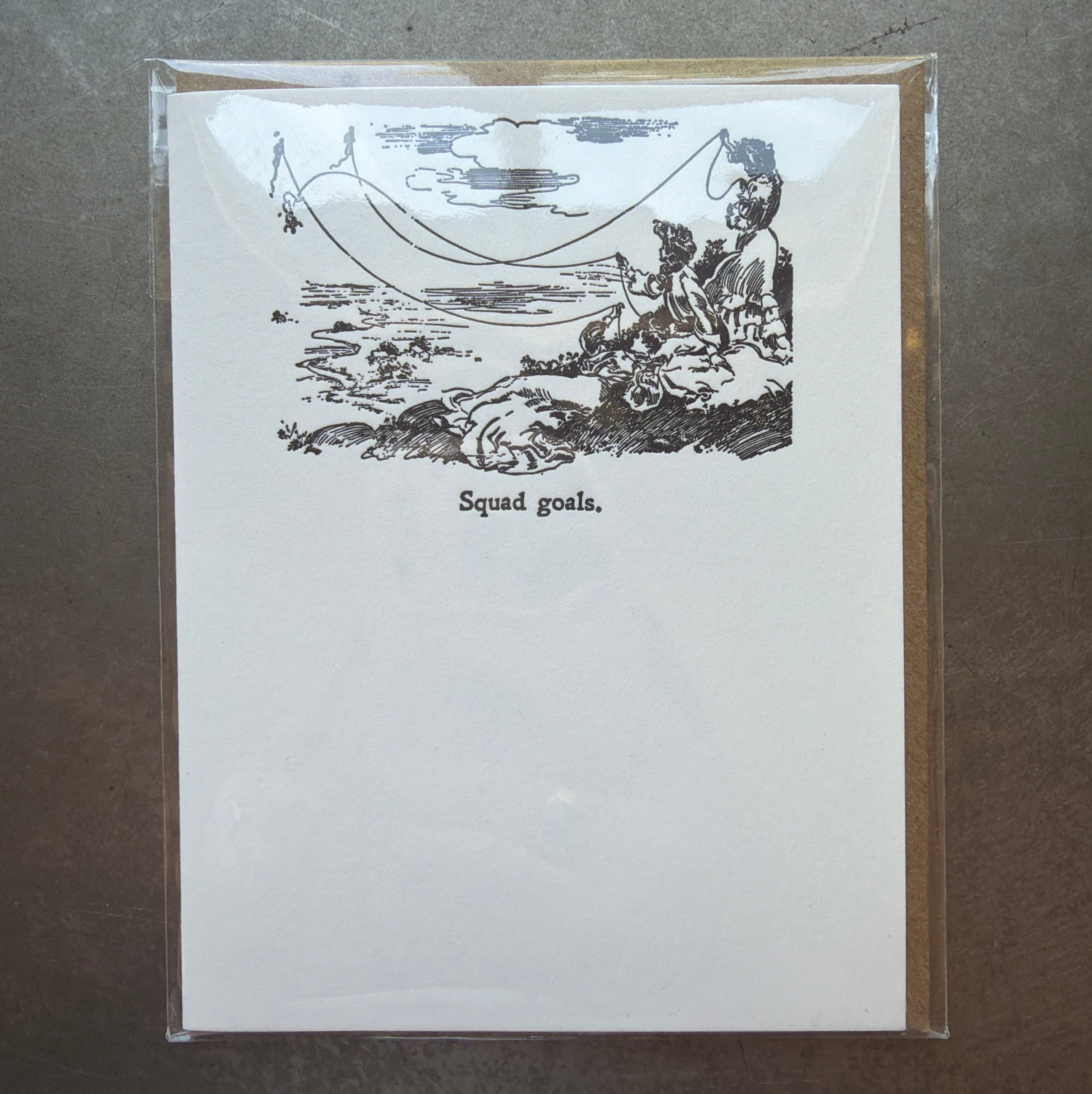Squad Goals Letterpress Greeting Card featuring a vintage-style black-and-white illustration of three people relaxing with a dog near a hammock, perfect for gifts and decor from Knotty and Board.