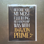 Funny black and white card with gold text humorously stating a fulfilling relationship with Amazon Prime, perfect as a gift or decor element from Knotty and Board, Fulfilled by Amazon Prime Funny Card. 1