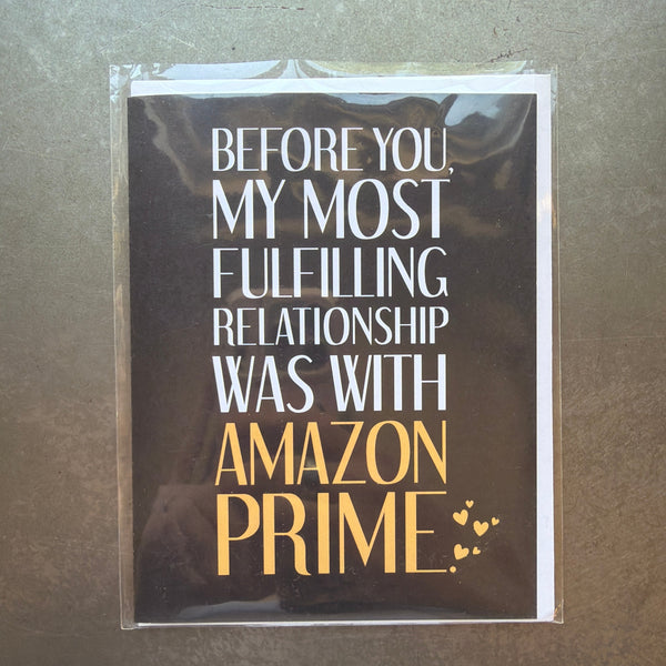 Funny black and white card with gold text humorously stating a fulfilling relationship with Amazon Prime, perfect as a gift or decor element from Knotty and Board, Fulfilled by Amazon Prime Funny Card.