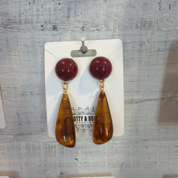 Bold Geometric Resin Drop Earrings featuring round burgundy studs with elongated amber resin drops, perfect for stylish gifts or jewelry lovers at Knotty and Board.