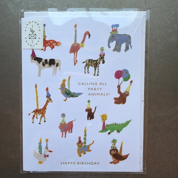 Seedlings Cards, Animal Party Birthday featuring colorful illustrated animals wearing party hats and holding balloons around the text "Calling all party animals! Happy birthday," perfect gifts and decor from Knotty and Board.