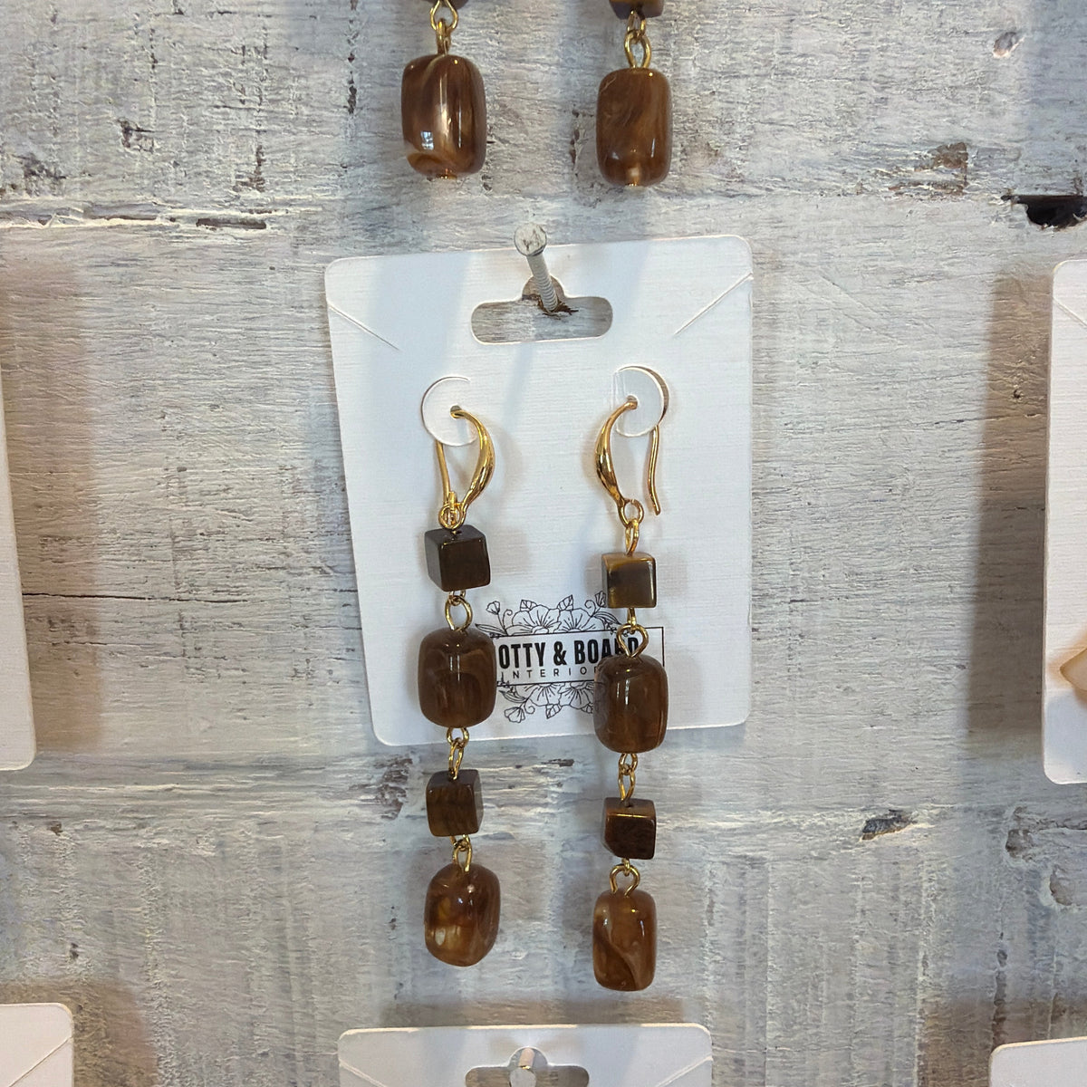 Artisan Long Tassel Drop Earrings with Tiger Eye displayed on branded card, featuring brown stone beads and gold-tone hooks, perfect for gifting or adding to jewelry decor.