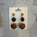 Retro Caramel Tone Stud Earrings with brown and caramel resin beads and gold-tone accents, perfect for adding a warm, stylish touch to your jewelry collection from Knotty and Board. 1
