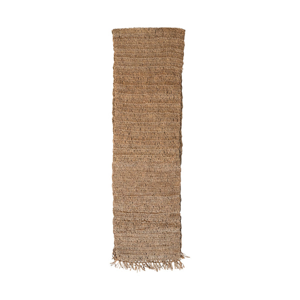 Woven Raffia Table Runner with Fringe in natural tones, featuring textured braided design and delicate fringed edges, perfect for adding rustic decor to dining and entertaining spaces.