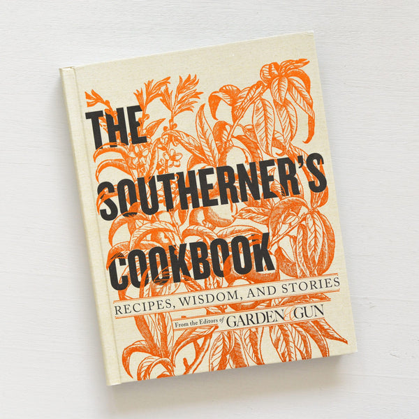 The Southerner's Cookbook with orange botanical illustrations on a cream cover, featuring recipes, wisdom, and stories, perfect decor and gift from Knotty and Board.