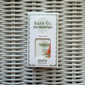 Pura Refill, Fir & Grapefruit fragrance refill in a white box with green and orange accents, displayed on woven wicker surface, ideal for Knotty and Board decor and gifts.