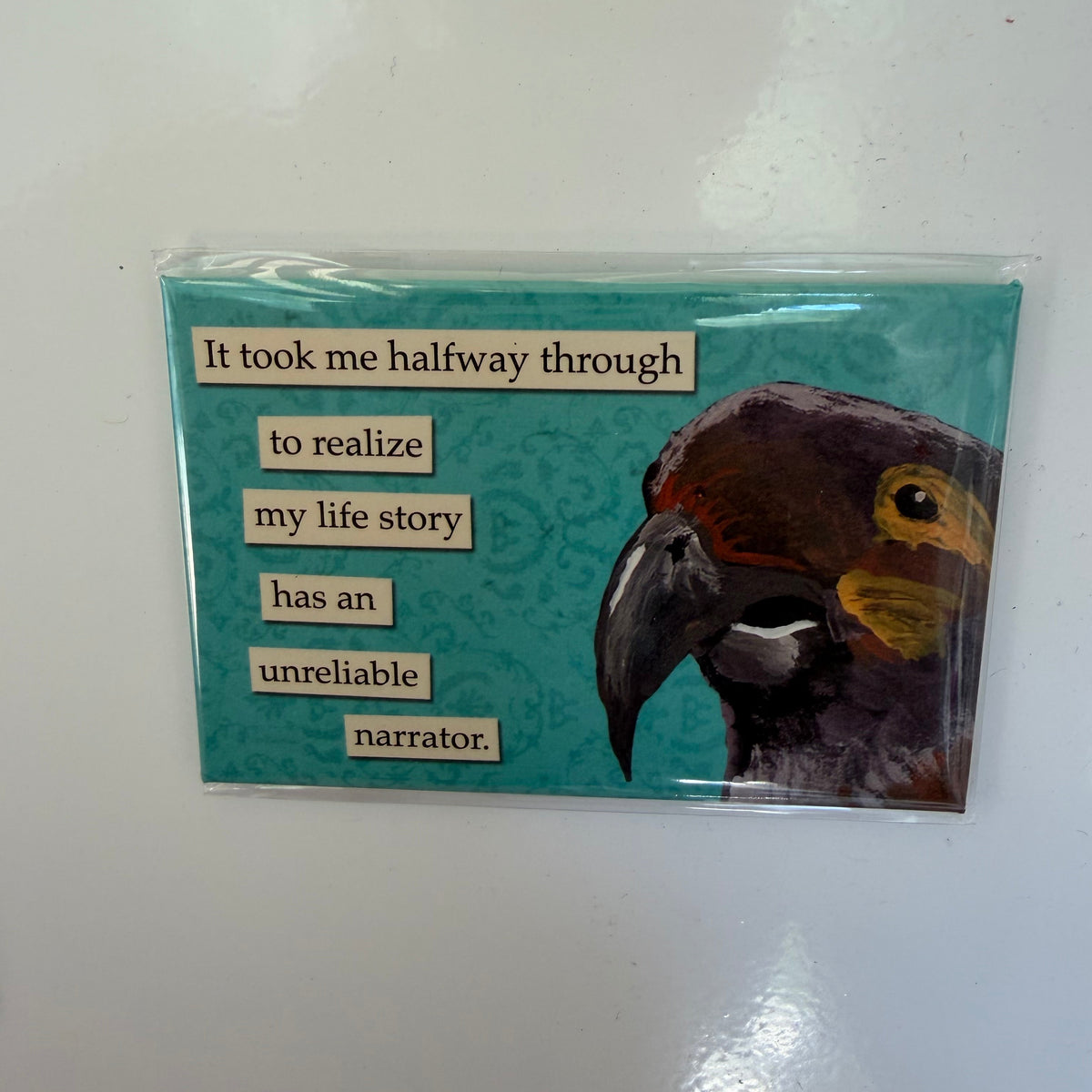 Funny Magnet, Unreliable Narrator with a humorous quote on a turquoise background featuring a colorful parrot illustration, perfect for kitchen or home decor gifts.