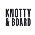 Bold black text on a white background spelling out Knotty and Board in a clean, modern font for a decor and gift brand logo.