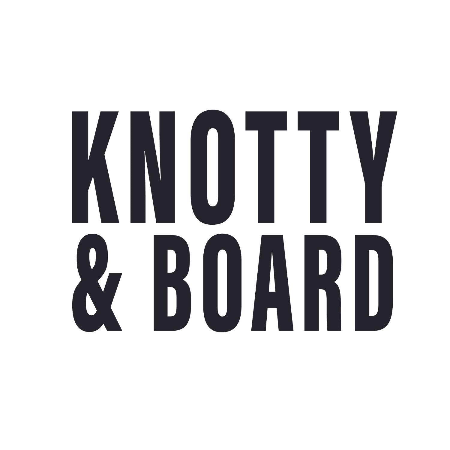 Bold black text on a white background spelling out Knotty and Board in a clean, modern font for a decor and gift brand logo.