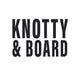 Bold black uppercase text reading "KNOTTY & BOARD" on a white background, representing a retail brand specializing in curated decor and gifts.