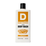 Bottle of Duke Cannon Body Wash, 18 oz., Sawtooth scent with alpine air and cedarwood, offered by Knotty and Board, perfect for adding a rugged touch to any bathroom decor or gift collection. 1