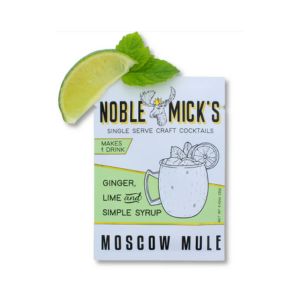 Noble Mick's Single Serve Craft Cocktail, Moscow Mule packaging beside a fresh lime wedge and mint leaf, perfect for entertaining and gifts from Knotty and Board.