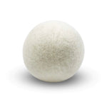 A single white Wool Dryer Ball made of natural wool fibers, perfect for eco-friendly laundry care and a thoughtful gift from Knotty and Board, every room needs a little Knotty and Board. 1