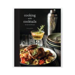 Cover of the book Cooking with Cocktails: 100 Spirited Recipes featuring a plated roasted chicken dish with vegetables and a cocktail glass alongside a shaker, styled for dining and kitchen decor.