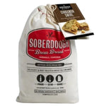 A cloth bag of Soberdough Brew Bread, Cinnamon Swirl artisan bread mix with a recipe card, displayed as a unique kitchen gift from Knotty and Board, perfect for entertaining and decor. 1