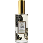 Voluspa Baltic Amber Room & Body Spray in a clear glass bottle with black floral designs and a shiny gold cap, perfect for adding elegant decor and fresh scents. 1