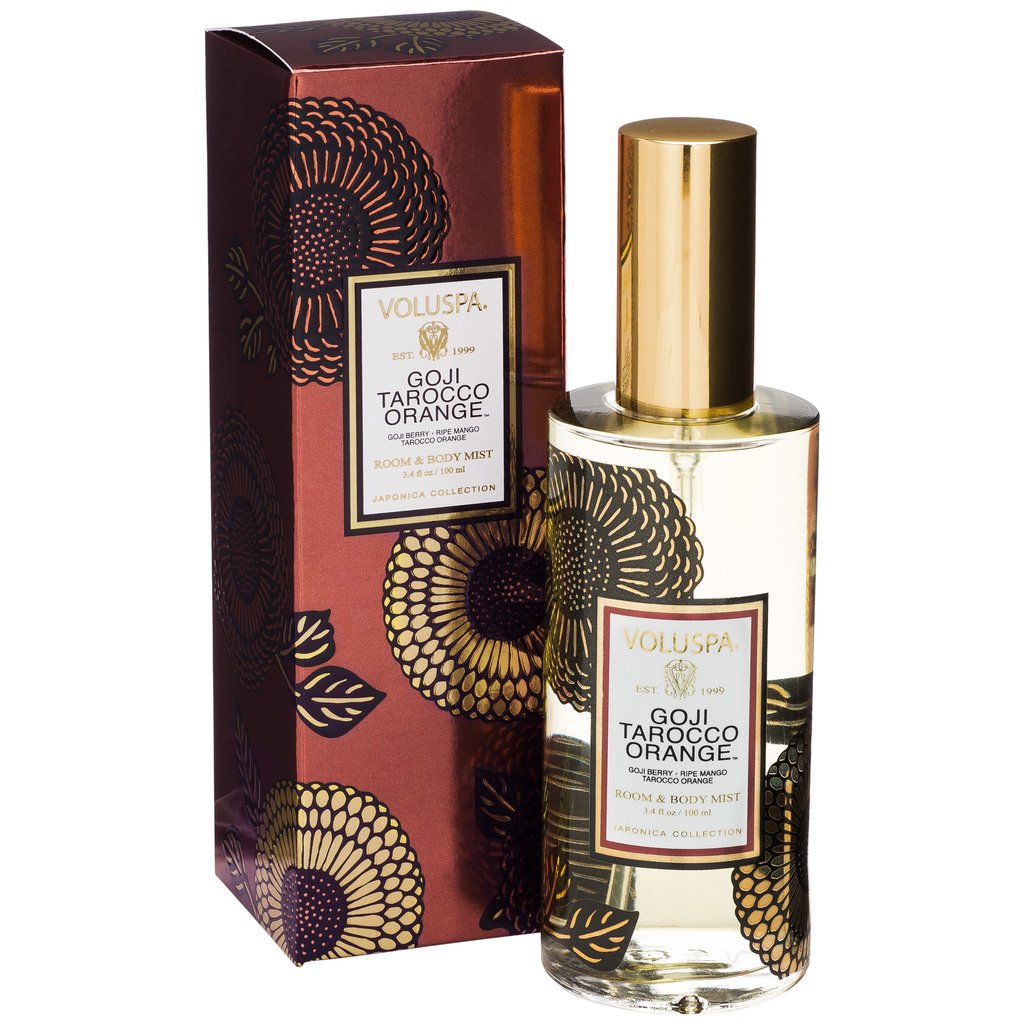 Voluspa Goji & Tarocco Orange Room & Body Spray, 3.4oz in a decorative bottle with gold cap beside matching floral patterned gift box, perfect for unique decor and gifts from Knotty and Board.