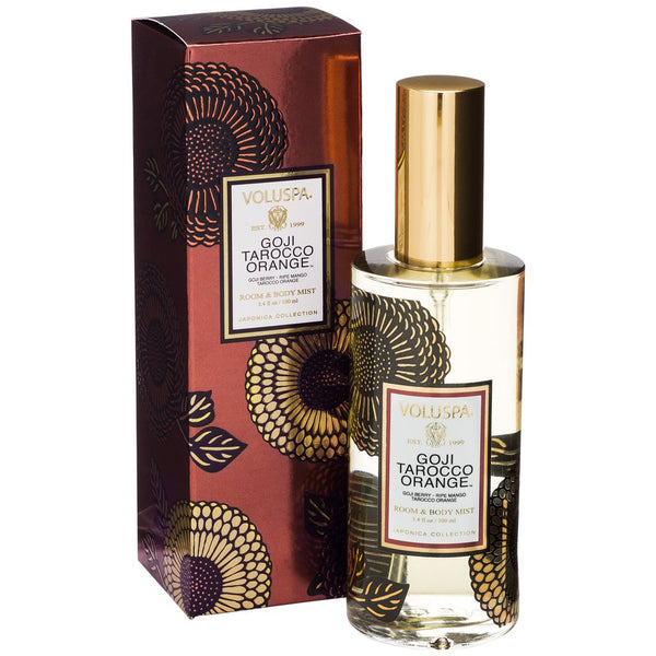 Voluspa Goji & Tarocco Orange Room & Body Spray, 3.4oz in a decorative bottle with gold cap beside matching floral patterned gift box, perfect for unique decor and gifts from Knotty and Board.