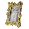 Duchess Frame, Gold, 10.6 X 8.3 in. featuring an ornate leaf-inspired gold design, perfect for displaying cherished memories and enhancing your home decor by Knotty and Board.