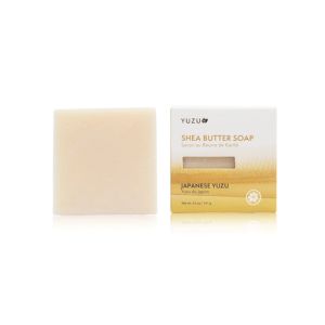 Yuzu Japanese Soap, Shea Butter bar with natural cream color beside its white and yellow packaging, showcased as a stylish gift or decor item for kitchen or bathroom.