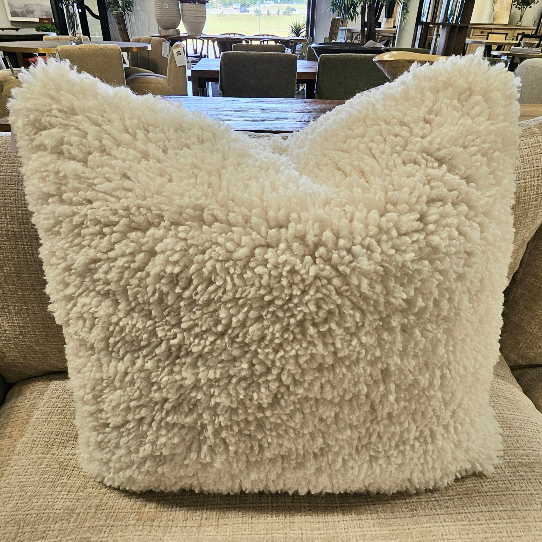 Fluffy, plush Designer Pillow Line Pixie Natural in soft cream tone, adding cozy texture and warmth to home decor, perfect for stylish living spaces at Knotty and Board.