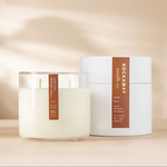 Rockaway Pale Fire Candle 16 oz with white soy wax in a clear glass container, accompanied by a white cylindrical box, featuring a brown label with scent details. 1