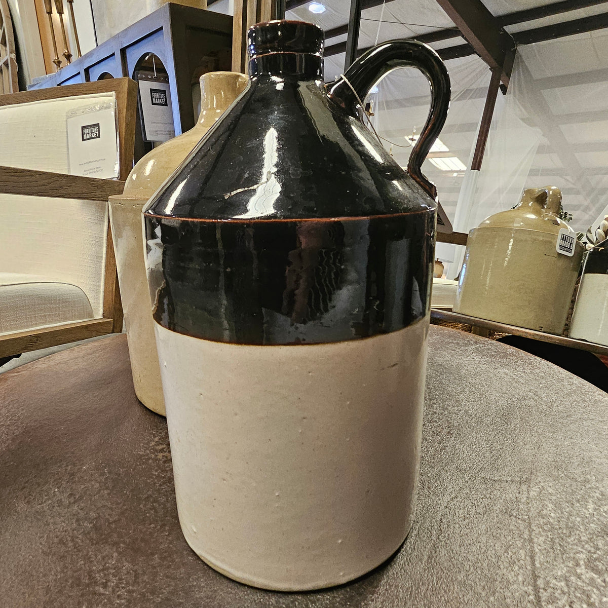 Brown Crock with handle featuring a two-tone rustic design, perfect for kitchen decor or as a charming gift from Knotty and Board. Every Room Needs A Little Knotty and Board.