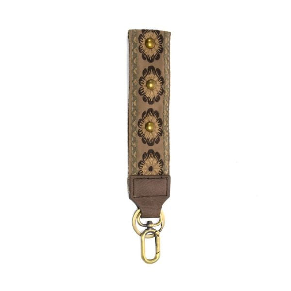 Easy Find Wristlet, Tan Studded Daisy featuring tan leather with studded daisy floral design and brass hardware, ideal for jewelry or gift decor from Knotty and Board.