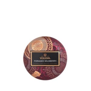 Voluspa Foraged Wildberry Mini Tin, 4 oz. candle with a decorative burgundy and gold patterned lid, perfect for adding a fragrant touch to kitchen or dining spaces.