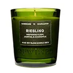 Rewined Candle 6oz Riesling in a green glass container with a label featuring notes of nectarine flesh, jasmine, and chamomile, perfect for cozy home decor and gifts. 1