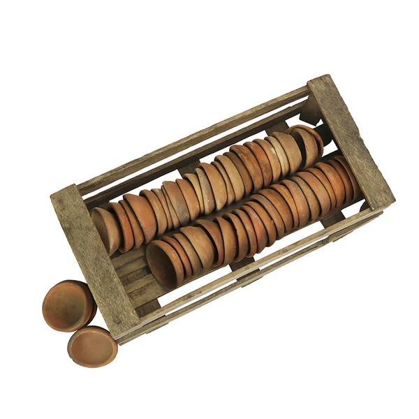 Wooden crate filled with stacked small terracotta Planter's Seedling pot, sold individually, suitable for home decor, gardening gifts, and personalized planting projects.