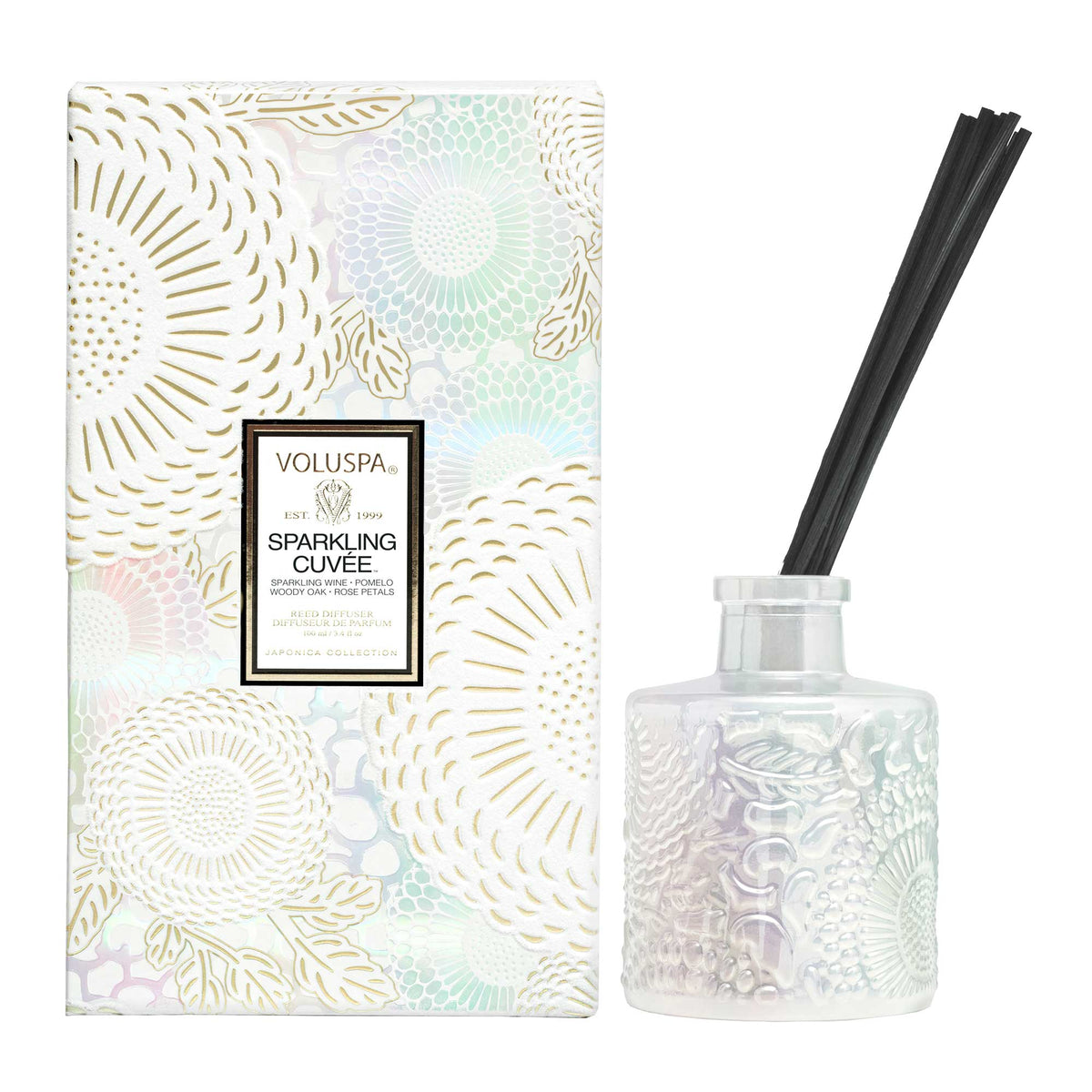 Voluspa Sparkling Cuvee Reed Diffuser, 3.4 oz with an iridescent embossed glass bottle and black reeds, packaged in a decorative floral box, perfect for gift and home decor from Knotty and Board.
