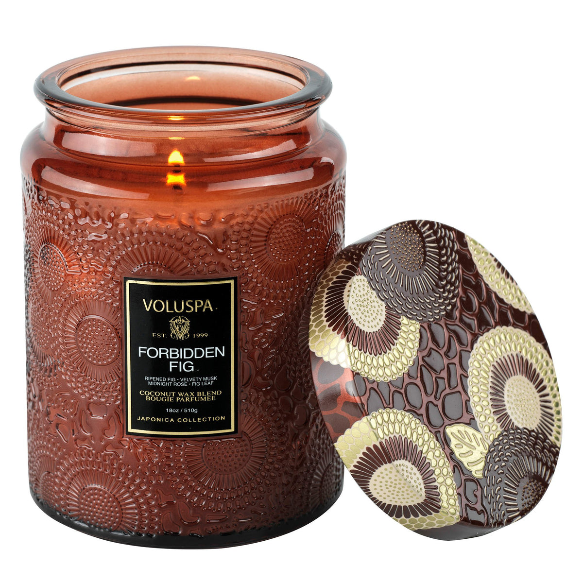 Voluspa Forbidden Fig Candle Jar, Large, 18 oz burning in a decorative embossed glass jar with a patterned lid, perfect for Knotty and Board décor and gifts collection.