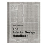 The Interior Design Handbook book cover featuring a minimalist architectural floor plan line drawing on a textured gray background, available at Knotty and Board with curated decor and gifts. 1