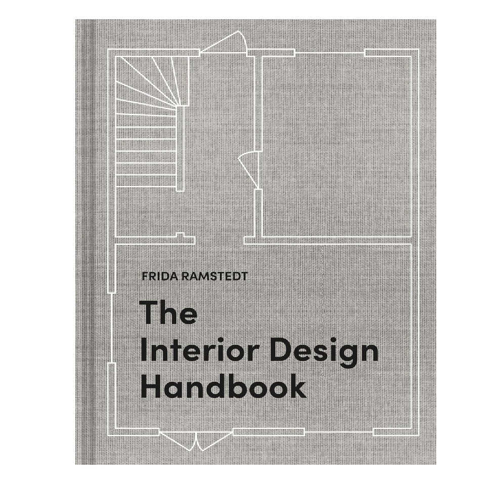 The Interior Design Handbook book cover featuring a minimalist architectural floor plan line drawing on a textured gray background, available at Knotty and Board with curated decor and gifts.
