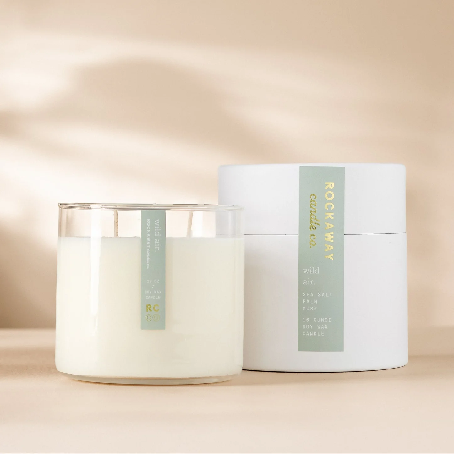 Rockaway Wild Air Candle 16oz with clean white wax in glass jar and minimalistic white packaging, ideal for home decor and gifting from Knotty and Board.