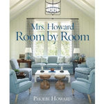 Cozy living room with soft blue armchairs, wooden stools, and a large window, highlighting styled home decor in Mrs. Howard, Room by Room. 1
