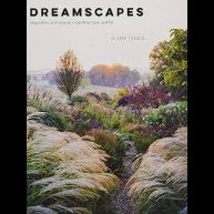 Cover of the Dreamscapes Book featuring a serene garden landscape with soft grasses, blooming flowers, and a misty morning sky, perfect for Knotty and Board decor gifts.