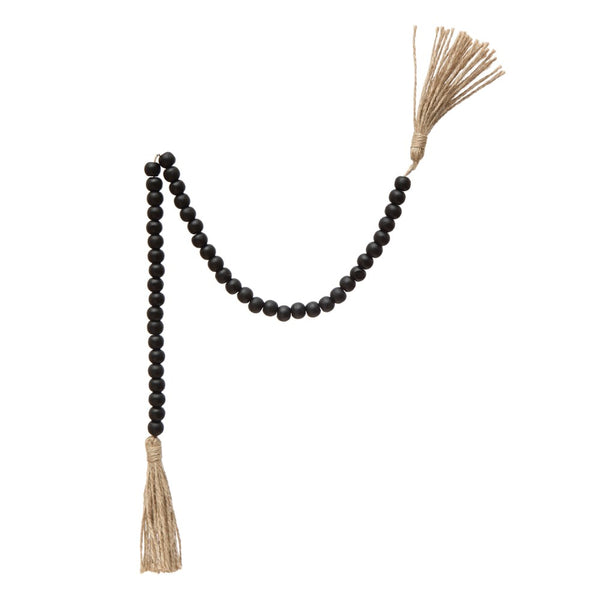 Wood Bead Garland w/ Jute Tassels, 28" featuring dark wooden beads and natural jute tassels, perfect for adding rustic charm to kitchen, dining, or living room decor from Knotty and Board.