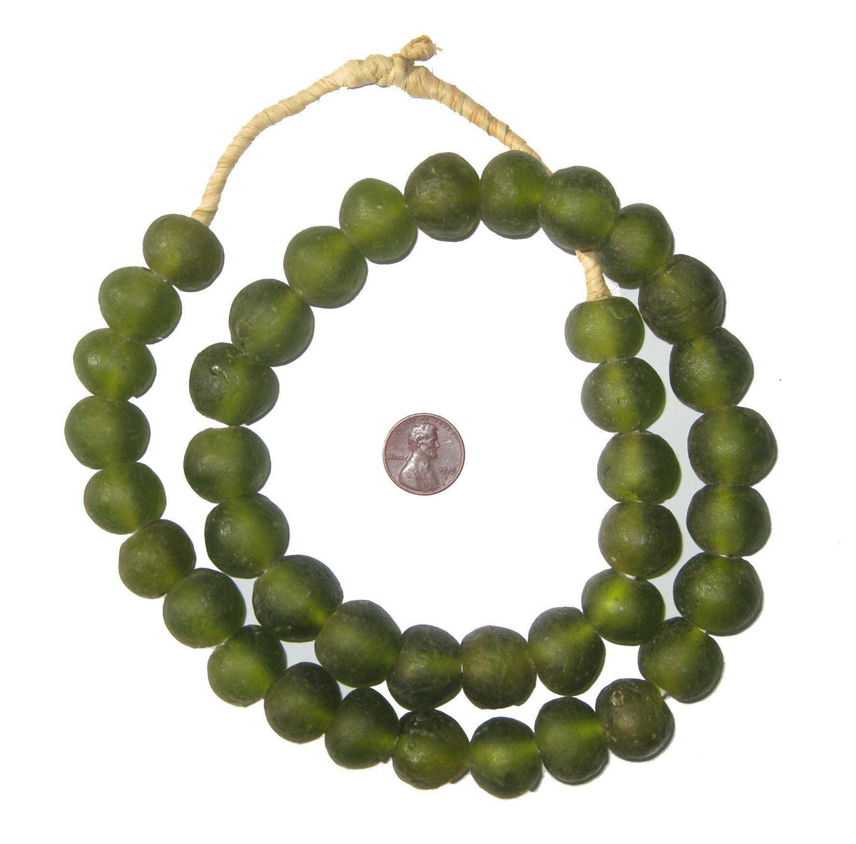 Strand of Olive Green Recycled Glass Beads, 18 mm, displayed with a coin for size reference, ideal for jewelry making and unique decor accents from Knotty and Board.