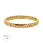 Narrow Flex Bangle, Water Resistant, Gold displayed on a white background, showcasing its sleek and flexible design, perfect for stylish jewelry lovers and gift shoppers. 1