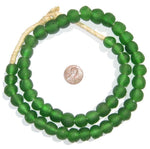 Green Recycled Glass Beads, 14 mm, arranged in a loose circle next to a penny for size comparison, perfect for unique jewelry or home decor from Knotty and Board. 1
