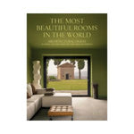 Cover of Architectural Digest magazine featuring a modern living room with green walls, a beige sofa, a tufted ottoman, and a large window overlooking a small chapel and outdoor greenery, showcasing elegant decor for kitchen and dining spaces. 1