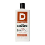 Bottle of Duke Cannon Body Wash, 18 oz., Big Bourbon with bold label design, white container, and black cap, available at Knotty and Board, perfect gift for body care and grooming. 1