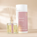 Rockaway French Citrus Reed Diffuser with agave, peach, and clementine scent in clear glass bottle with natural reeds, shown with white and pink decorative packaging, perfect for kitchen or dining decor.