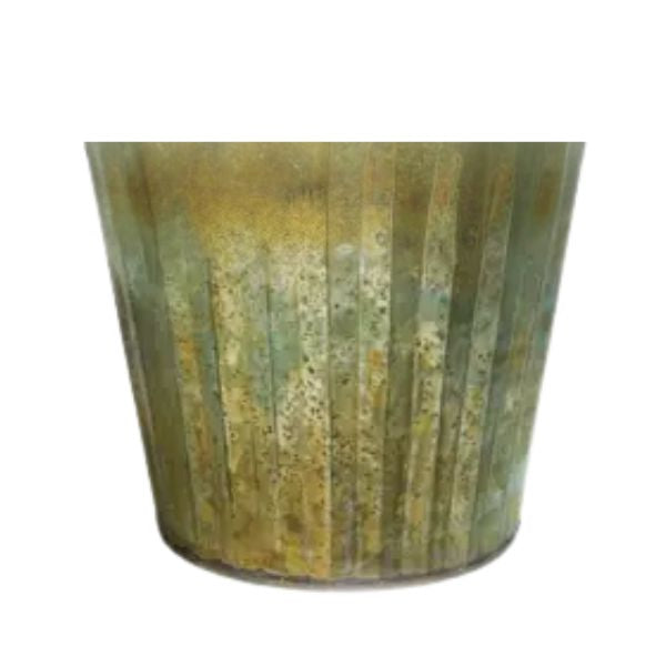 Close-up of a rustic metal container with verdigris patina, showcasing the weathered texture and aged greenish-gold finish of the Tin Planter, Verdigris, 7 X 6 in, perfect for unique home decor from Knotty and Board. Every Room Needs A Little Knotty and Board.