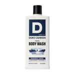 Bottle of Duke Cannon Body Wash, 18 oz., Midnight Swim with sandalwood and lavender scent, featuring a blue label and minimalist design, offered by Knotty and Board. 1