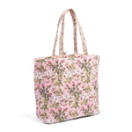 Quilted floral tote bag in soft pink with green and white blossoms, featuring long handles for easy carrying, perfect for stylish everyday decor and gifts - Tote Bag, Jasmine Joy. 1