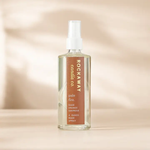 Rockaway Pale Fire Room Spray bottle with sage, orange, and oakmoss scent on a wooden surface, perfect for home decor and gifts from Knotty and Board. 1