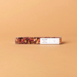 Teaspressa Luxe Mini Toppings, Rose Petals in a clear rectangular container with dried rose petals inside, styled on a neutral beige background for kitchen or dining decor. 1